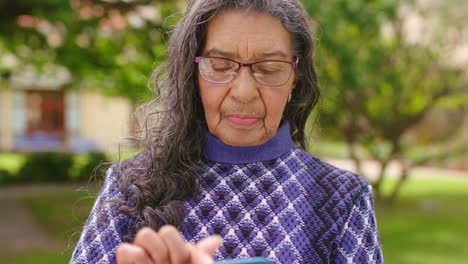 Senior-woman,-phone-or-internet-game-on-nature