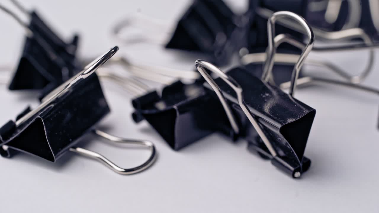 a black clamps on a white background. Subjects for office work and school