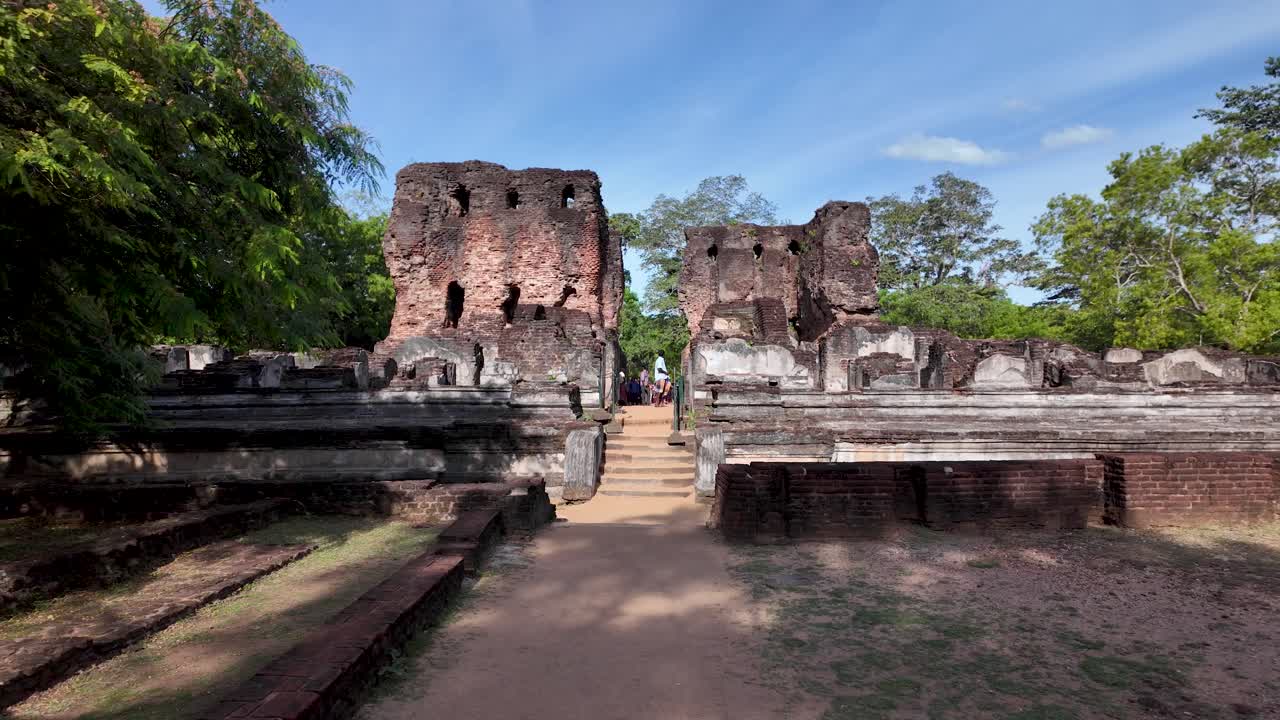Locals visit the ancient ruins of the Royal Palace of King Maha Parakramabahu in Polonnaruwa, Sri Lanka
