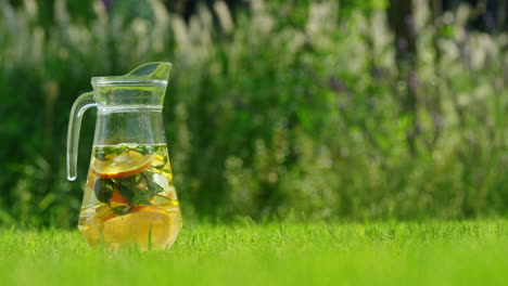 refreshing summer drink in a glass pitcher