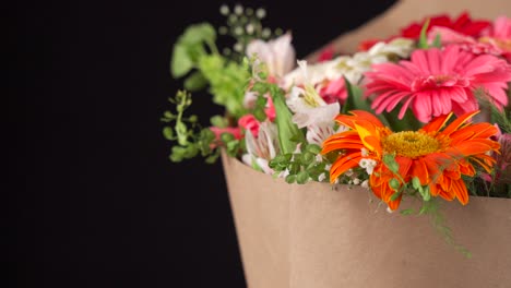 gerbera and lily flowers arrangement bouquet slider shot black background
