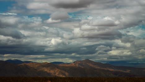 daytime cloudscape time lapse over mountains beyond the mojave desert basin