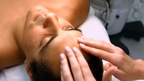 male patient receiving massage from doctor