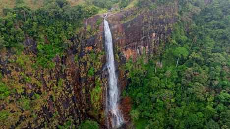 experience a stunning aerial perspective of diyaluma fall captured by drone in ella, sri lanka.