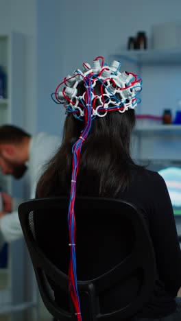 woman undergoing an eeg brain scan in a research laboratory