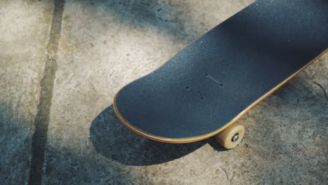 skateboard on a concrete background at a skatepark in the summer