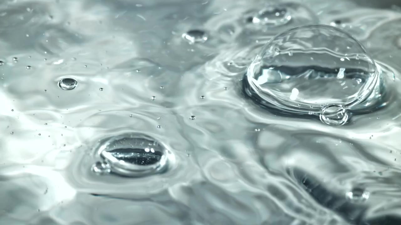 Clear Water Surface with Bubbles and Gentle Ripples