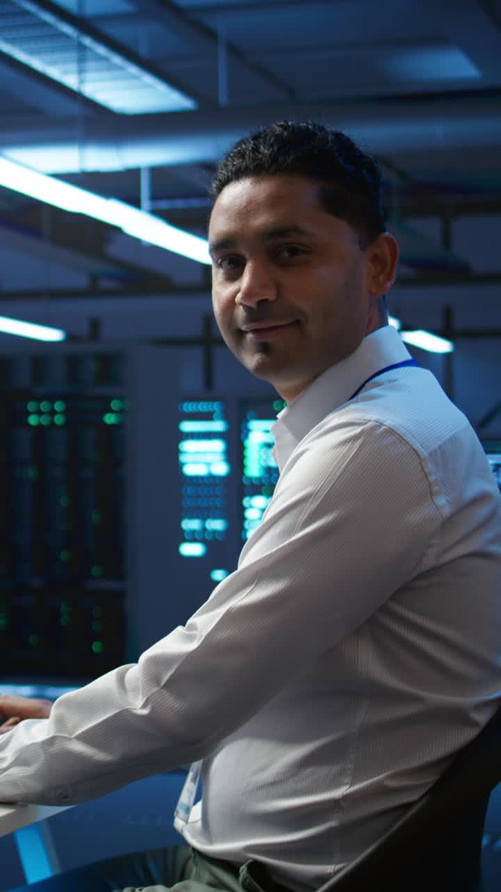 IT Professional Smiling in a Modern Data Center
