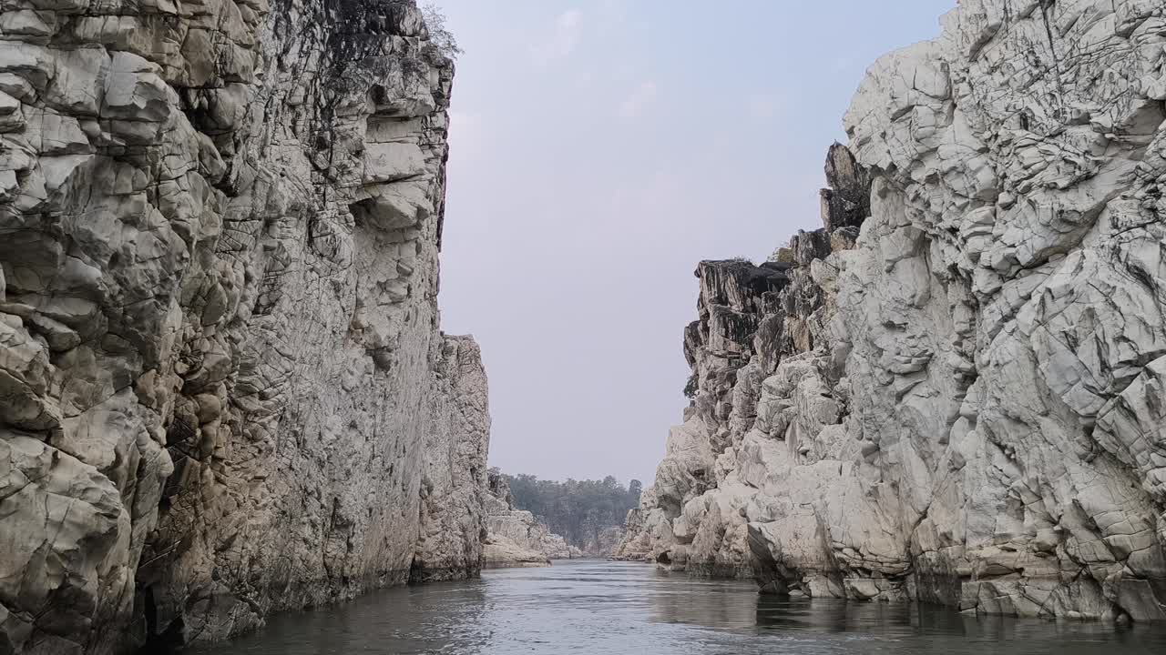 A point-of-view shot of a boat traversing the Narmada River through the Marble Rocks in Jabalpur