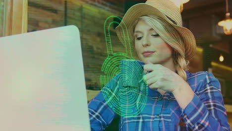 Animation-of-security-padlock-icon-against-caucasian-woman-wearing-a-hat-drinking-coffee-at-a-cafe