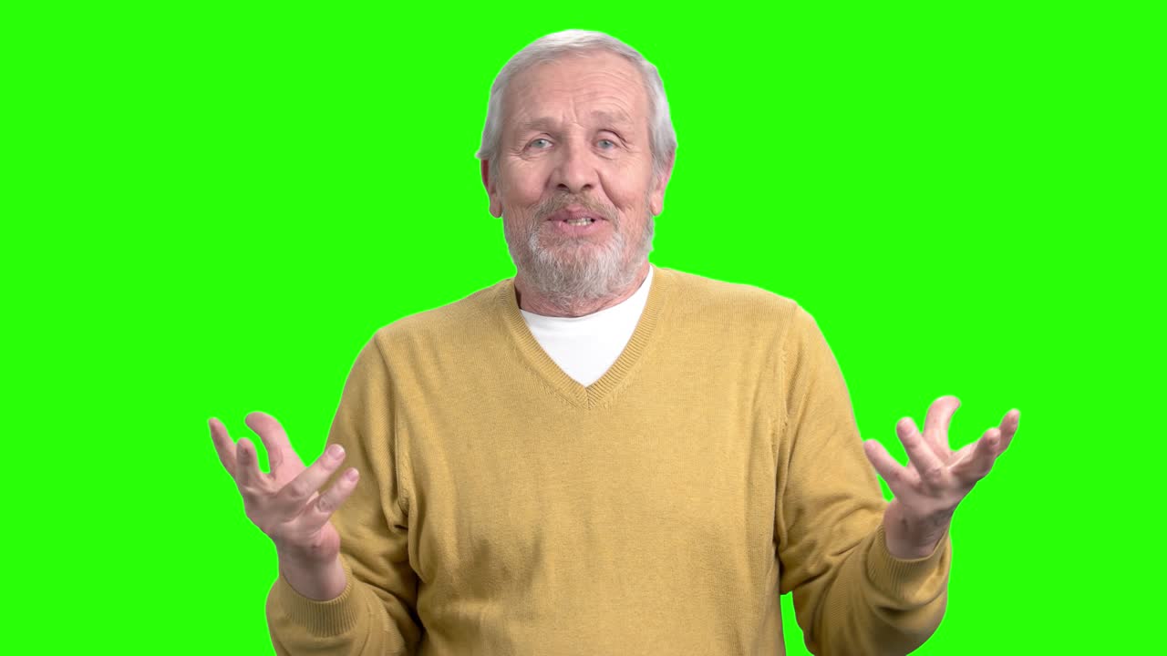 Happy elderly man speaking and gesturing.