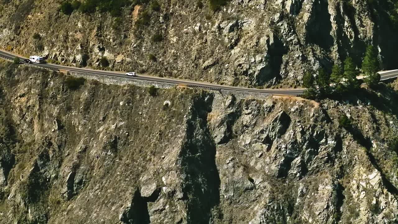 Driving along a winding road in California's mountainous area