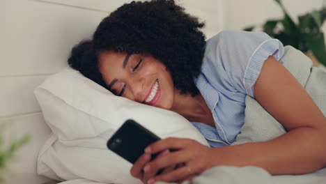 Phone-text,-happy-woman-and-bed-of-a-young-female