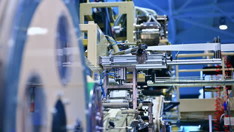 manufacturing automated technology for making diapers. rotation roller of cellulose.
