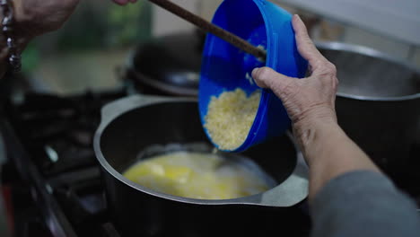 inishing the bagna cauda sauce by pouring in ingredients