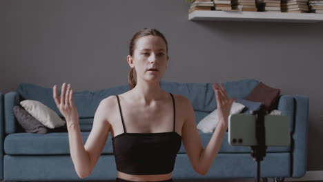 Young-Influencer-Woman-Recording-A-Yoga-Lesson-With-Her-Smartphone-Camera