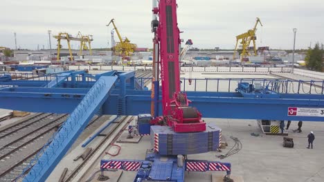 large crane maintenance and operation at an industrial port