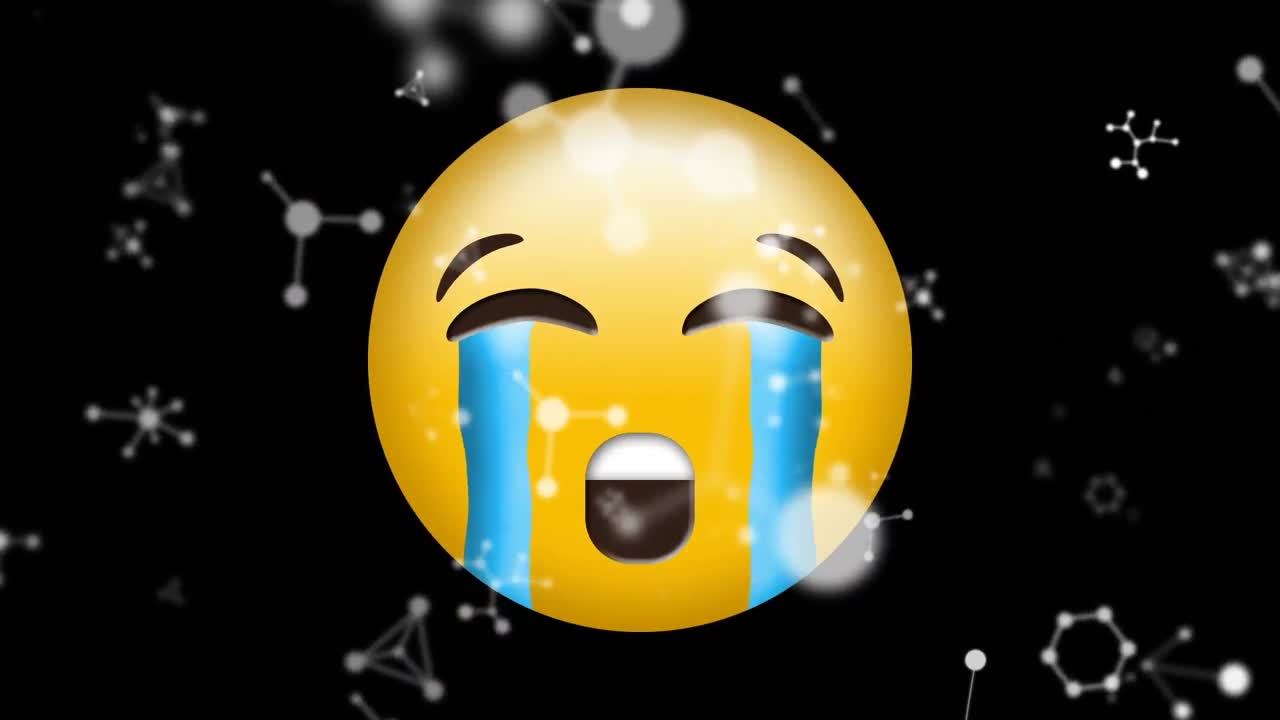 블랙 배경에 울고 있는 얼굴 이모지 위에 떠다니는 분자 구조의 디지털 애니메이션