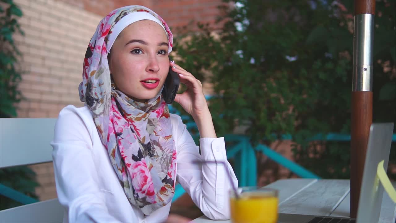 Young Woman Working in Outdoor Cafe