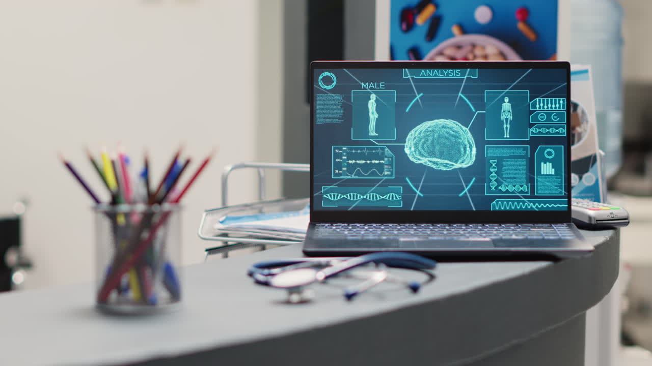 Empty desk with brain x ray on laptop