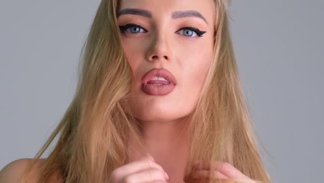 beautiful blonde girl looks up and stares into camera in slow motion beautiful blonde girl looks up and stares into camera in slow motion