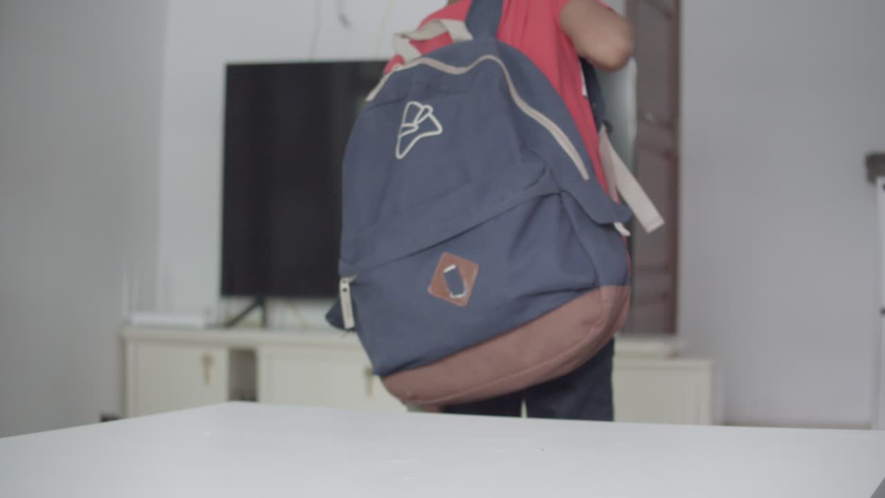 Elementary Student Going To School Took His Backpack On Table