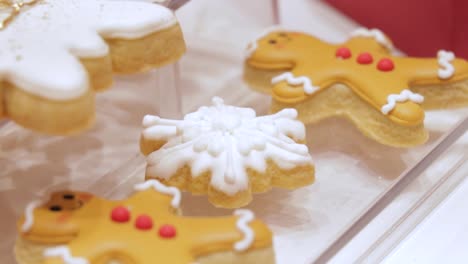 gingerbread cookies with frosting, holiday desserts on display