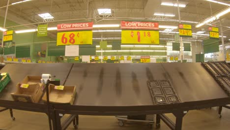 empty produce bins at the grocery store days after devastating winter storm uri