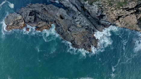 picturesque view of rocky cliff and sea against sky