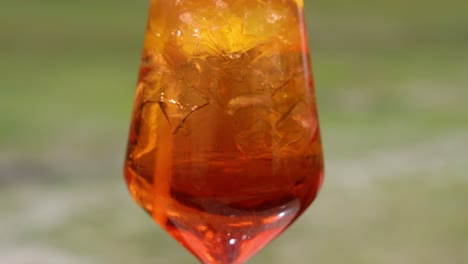 refreshing aperol spritz with lemon and ice