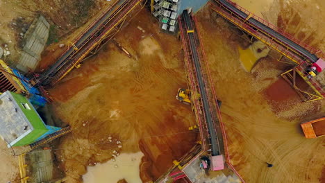 View-from-above-excavator-loader-in-sand-quarry.-Dumper-trucks-with-cargo-sand