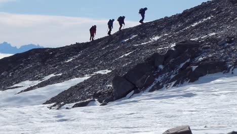 hikers on a rocky mountain summit