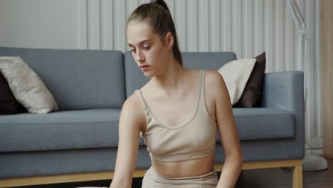 woman stretching at home