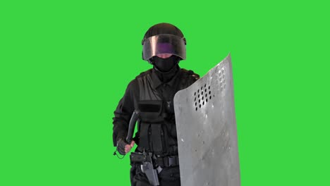 soldier in full uniform with armor, baton, protective shield running on a green screen, chroma key