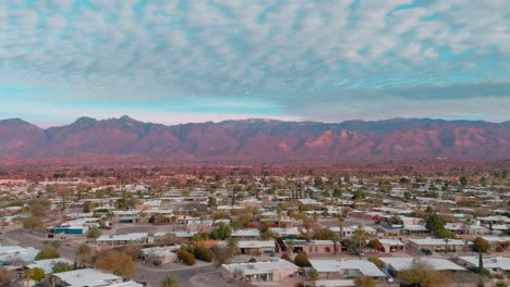 epic drone shot of tucson arizona with tucson mountains in background