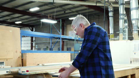 carpenter at work in woodshop