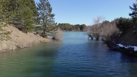 aerial view aoos spring lake narrow pass with trees greece