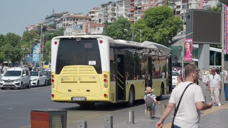 people wait at a bus stop in istanbul, turkey.