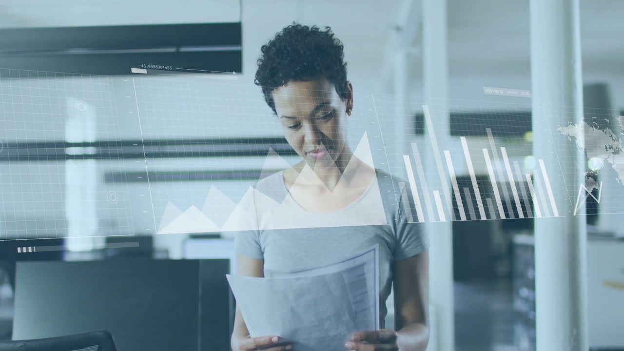 Animation of financial data processing over biracial businesswoman in office