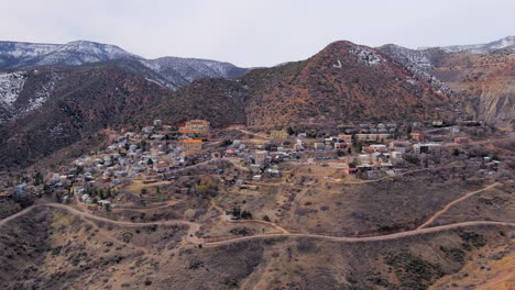 jerome old mountainside mining town, arizona establishing aerial view rising away to reveal valley landscape