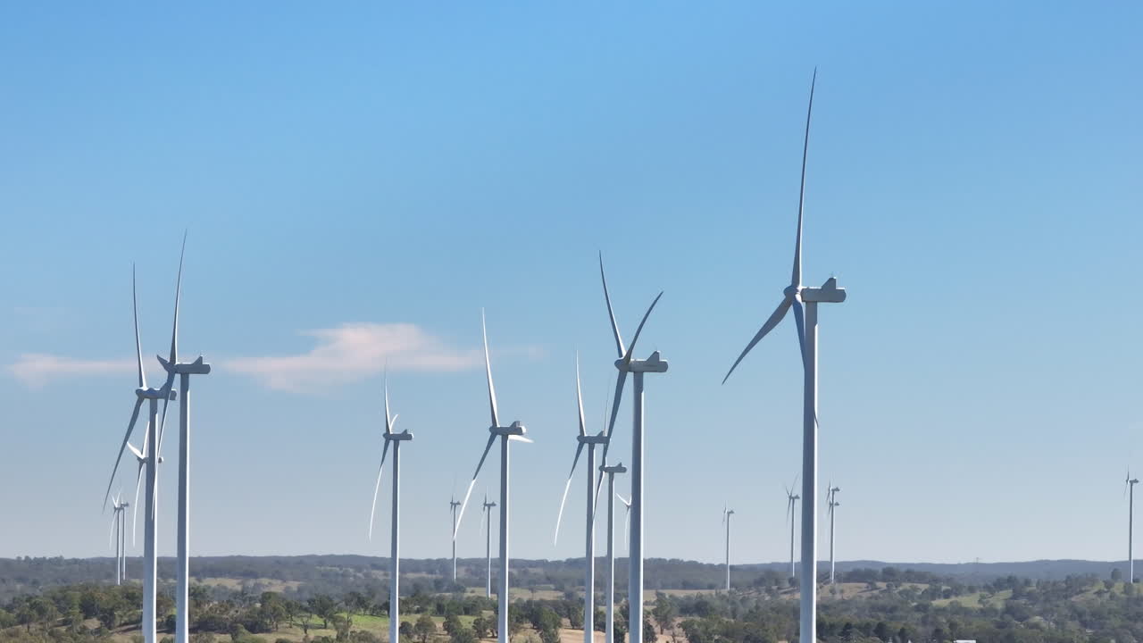 Drone Flyover Wind Turbines In Australian Countryside With Blue Sky, 4K