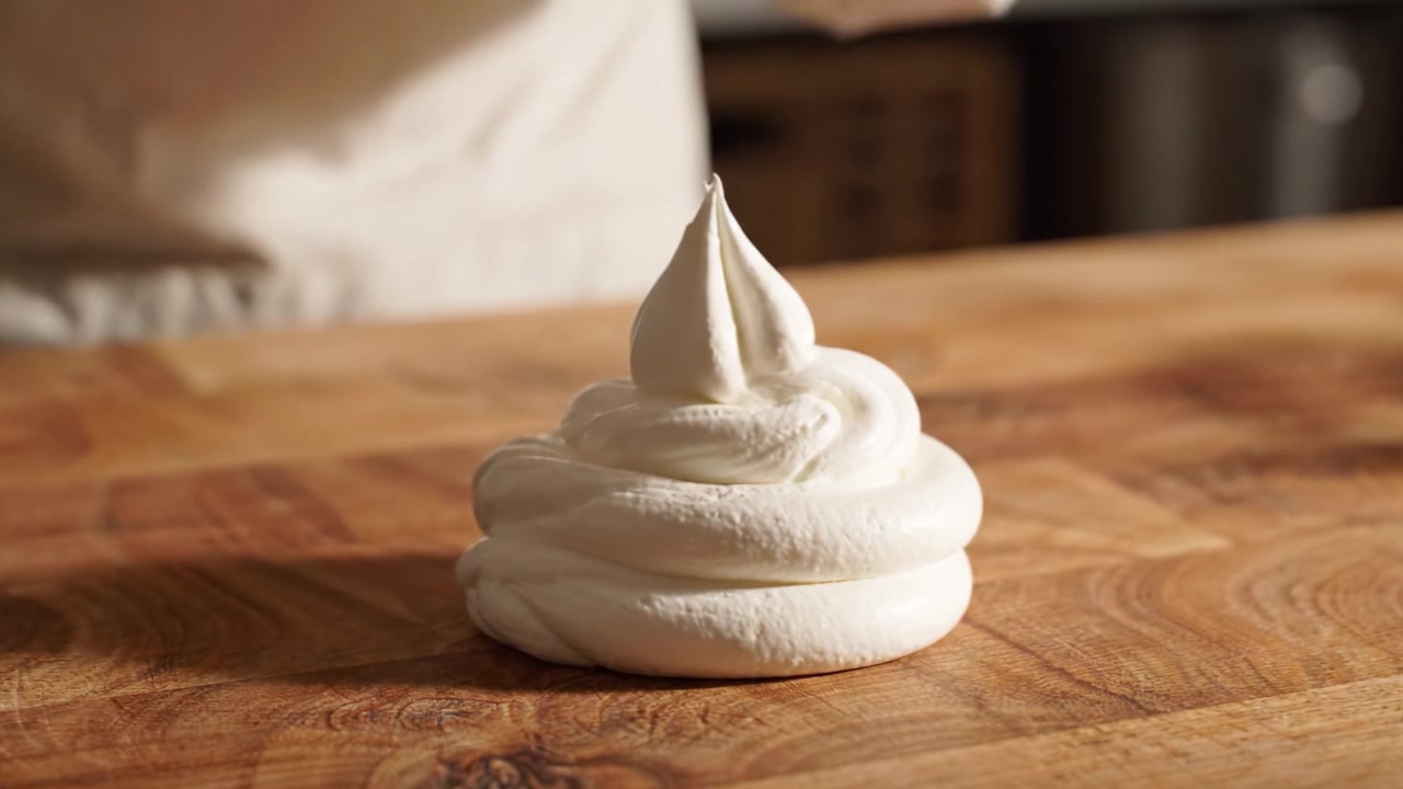 Creating a Perfect Swirl: The Art of Piping Cream to Achieve Beautiful Decorative Toppings for Pastries and Desserts in Culinary Practice