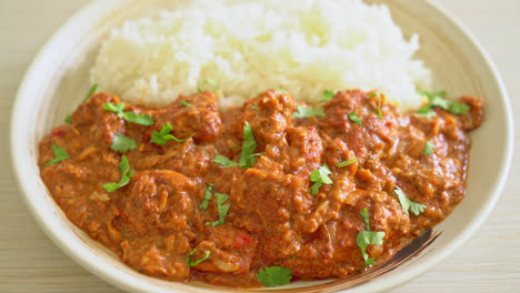 chicken tikka masala with rice on plate - indian food style