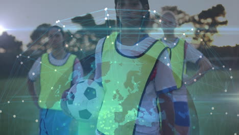 Holding soccer ball, athletes with digital network and world map animation