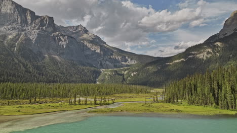 Emerald-Lake-BC-Canada-Aerial-v10-flyover-the-lake-along-the-river-capturing-coniferous-saplings,-forested-valleys-and-mountain-ranges-at-Yoho-National-Park---Shot-with-Mavic-3-Pro-Cine---July-2023