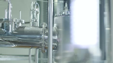 modern craft brewery. craft beer production. modern equipment in brewery, metal tanks, alcoholic drink production