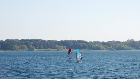 wide shot of beginner windsurfers