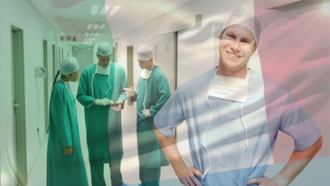 animation of flag of italy over diverse surgeons in hospital