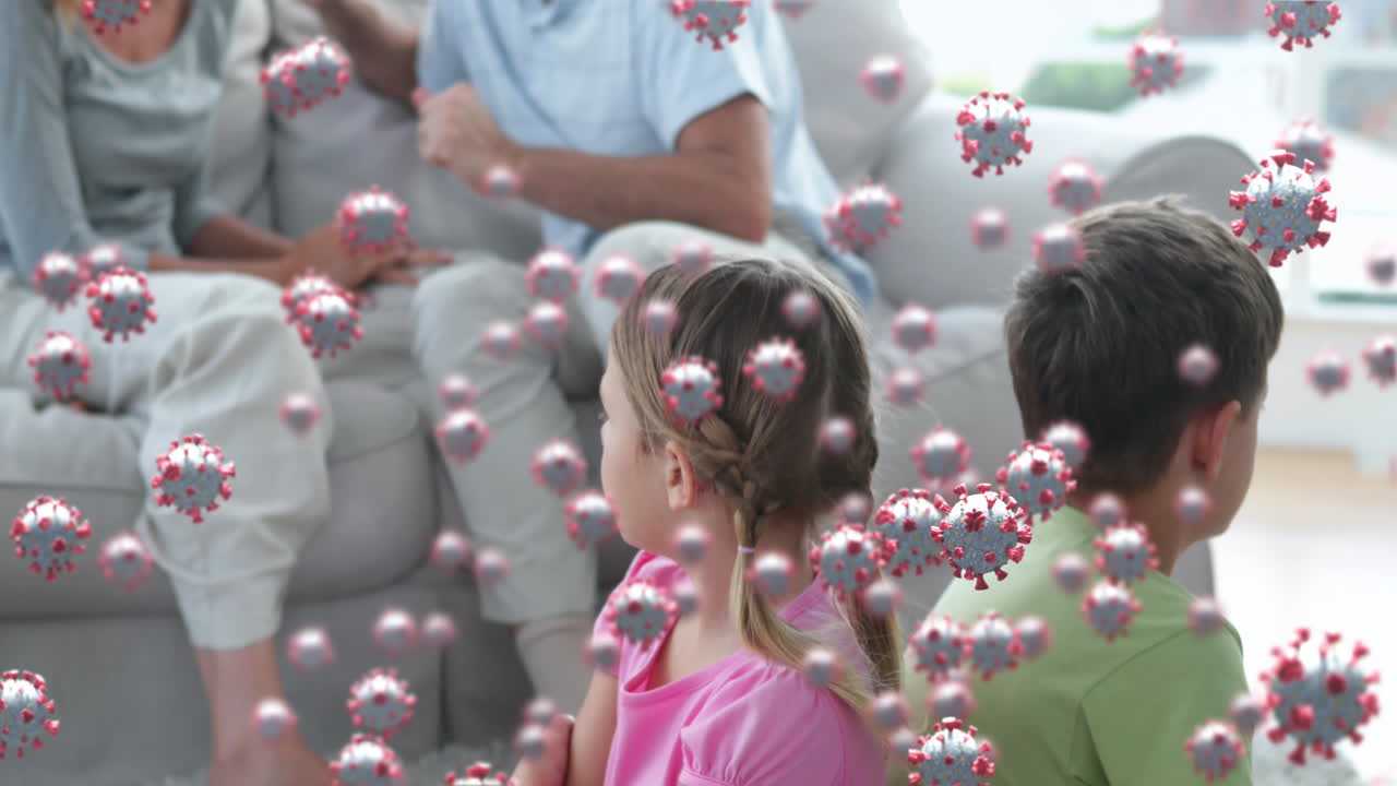 백그라운드에서 싸우는 가족을 상대로 움직이는 코로나19 세포의 디지털 복합 비디오