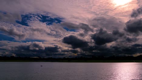 Time-Lapse-of-a-Dramatic-Sky-at-dusk,-with-normal-speed-for-the-lake